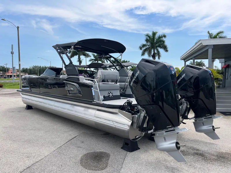 Slide: The Image of 2026 Avalon 2785 Excalibur LTD boat with twin Mercury 400hp V-10 engines, parked outdoors. - 7