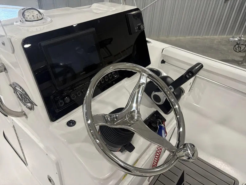 Slide: The Image of 2026 Tidewater 1910 BM boat dashboard with steering wheel and control panel. - 16