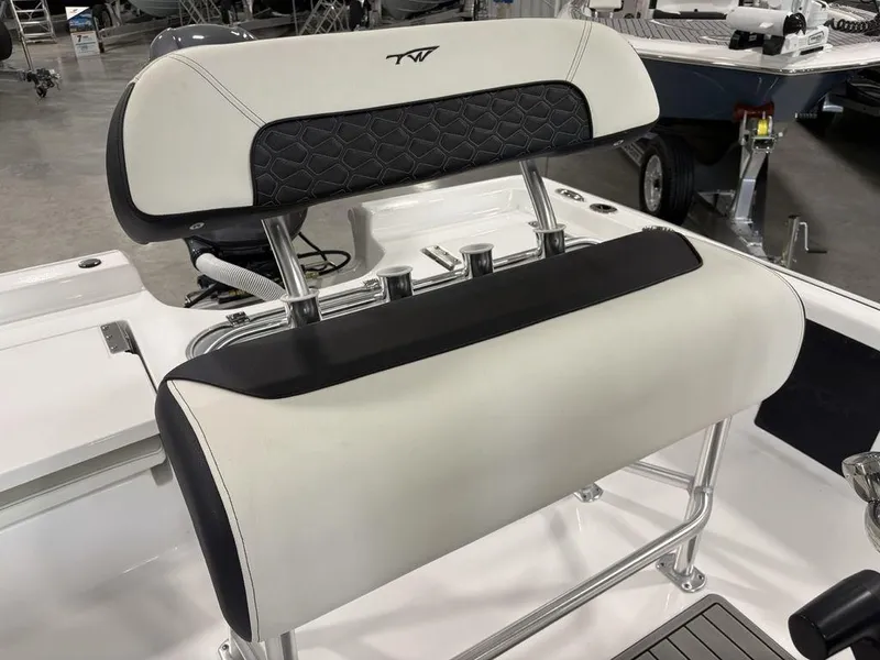Slide: The Image of 2026 Tidewater 1910 BM boat seat with black and white upholstery in showroom. - 22