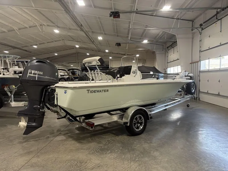 Slide: The Image of 2026 Tidewater 1910 BM boat in showroom, featuring Yamaha outboard motor. - 3