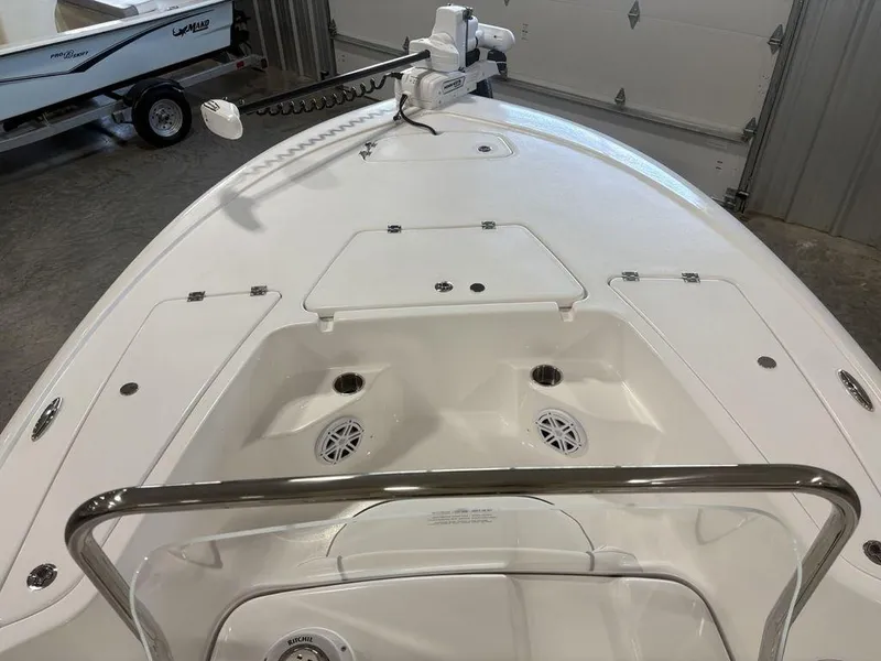 Slide: The Image of 2026 Tidewater 1910 BM boat interior with storage compartments and trolling motor. - 4