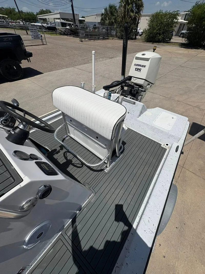 Slide: The Image of Custom 2013 boat interior with steering console and Evinrude 135 outboard motor. - 10