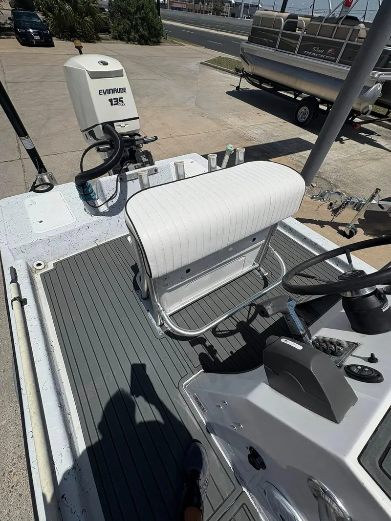 Slide: The Image of Boat interior with Evinrude 135 motor, custom seating, and steering console, 2013 model. - 11