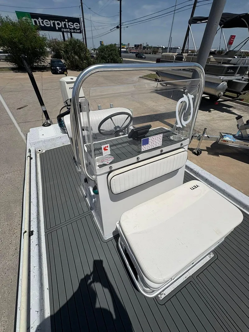 Slide: The Image of Custom 2013 boat console with steering wheel and Yeti cooler on deck. - 6