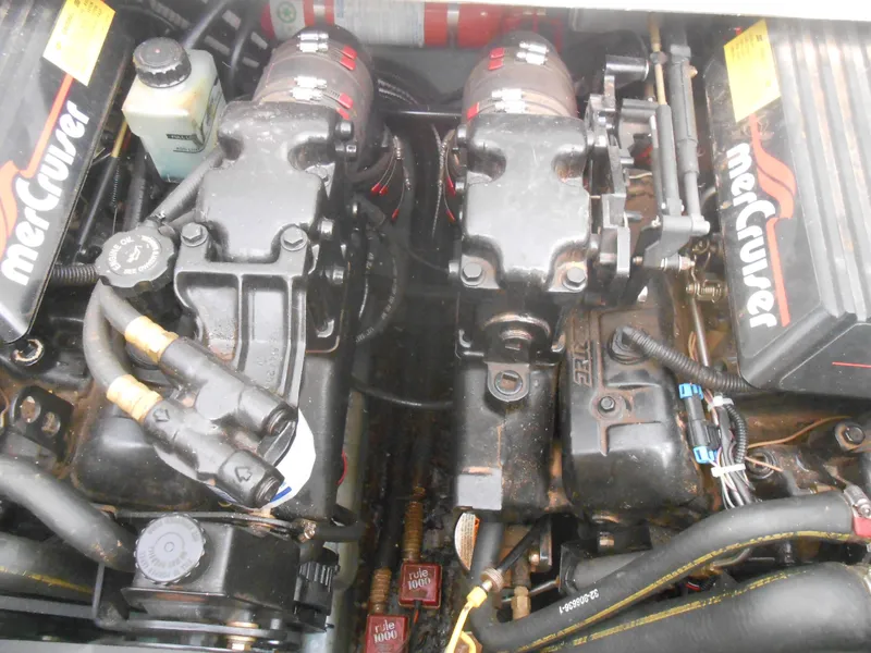 Slide: The Image of Engine compartment of a 1996 Sea Ray 290 Sundancer with MerCruiser components. - 13