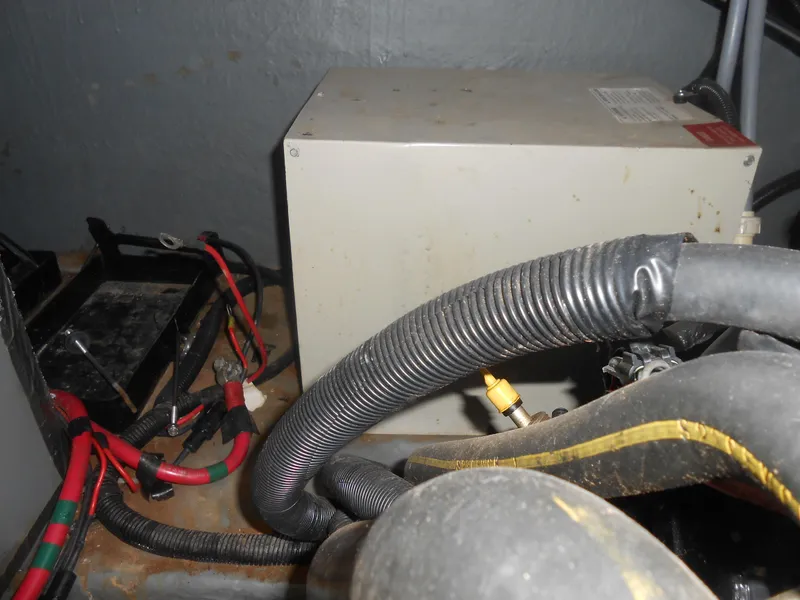 Slide: The Image of Engine compartment of a 1996 Sea Ray 290 Sundancer with cables and components. - 15