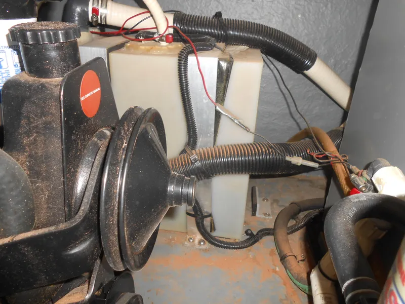 Slide: The Image of Engine compartment of a 1996 Sea Ray 290 Sundancer with hoses and components. - 16