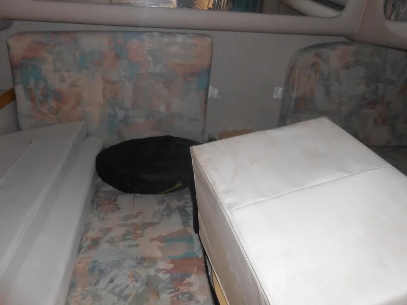 Slide: The Image of Interior cabin of a 1996 Sea Ray 290 Sundancer with patterned upholstery. - 24