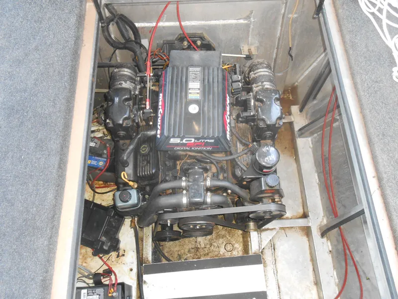 Slide: The Image of Engine compartment of a 1996 Sea Ray 290 Sundancer boat, featuring a MerCruiser 5.0L engine. - 9