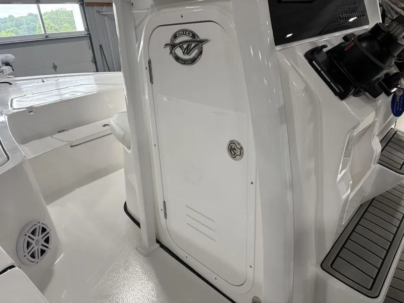 Slide: The Image of 2026 Tidewater 2110 BM boat interior with sleek white design and modern features. - 11