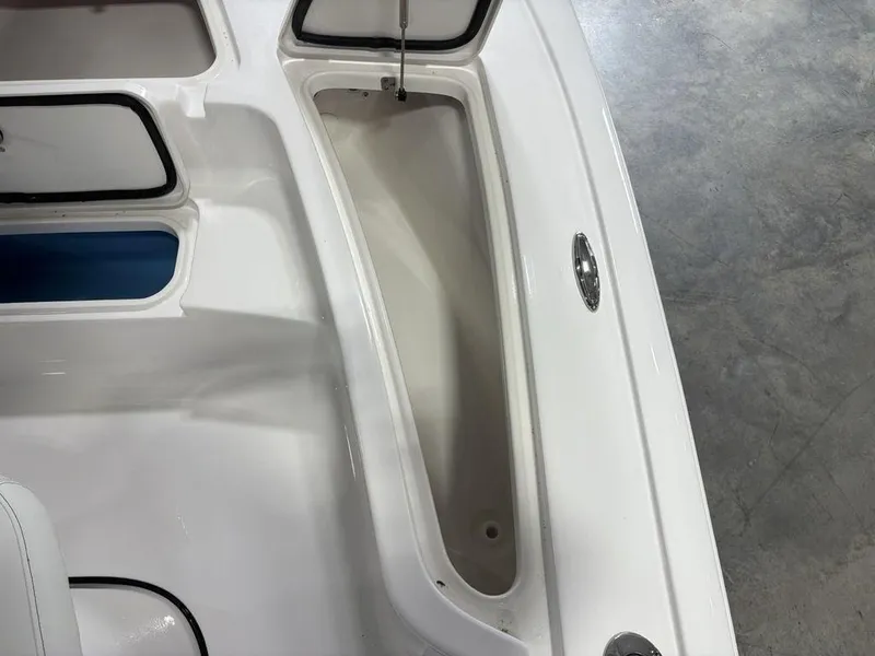 Slide: The Image of Interior view of a 2026 Tidewater 2110 BM boat, showcasing storage compartments. - 13