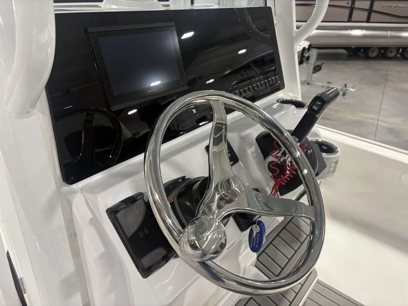 Slide: The Image of 2026 Tidewater 2110 BM boat console with steering wheel and control panel. - 20