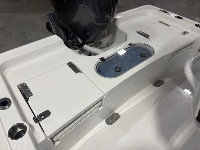 Slide: The Image of 2026 Tidewater 2110 BM boat interior with storage compartments and motor. - 22