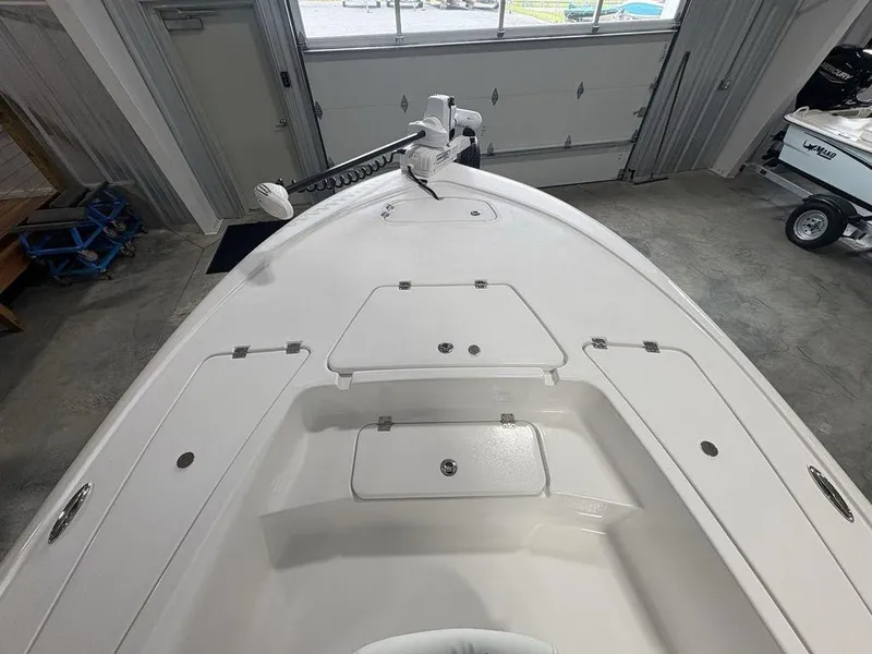 Slide: The Image of 2026 Tidewater 2110 BM boat interior with storage compartments in a showroom. - 4