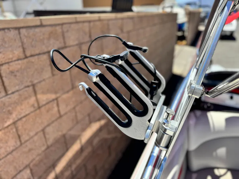 Slide: The Image of Wakeboard rack on a 2008 Tigé RZ2 boat, mounted on a metal frame. - 12