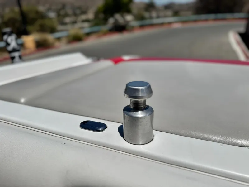 Slide: The Image of Close-up of a 2008 Tigé RZ2 boat detail, featuring a metal fitting. - 15