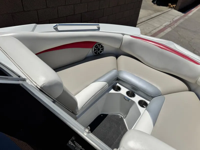 Slide: The Image of 2008 Tigé RZ2 boat interior with cushioned seating and cup holders. - 17