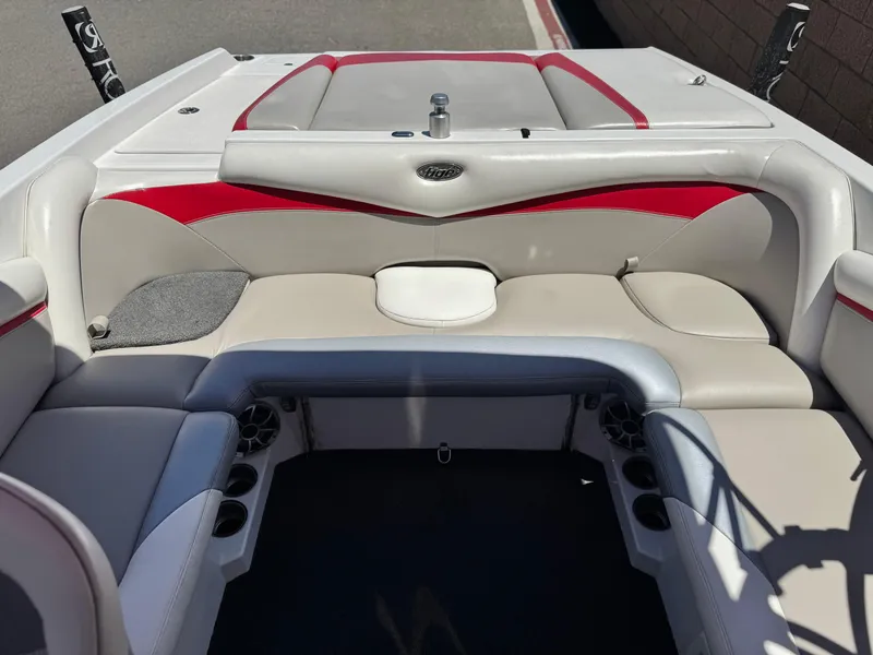 Slide: The Image of 2008 Tigé RZ2 boat interior with red and white seating. - 20