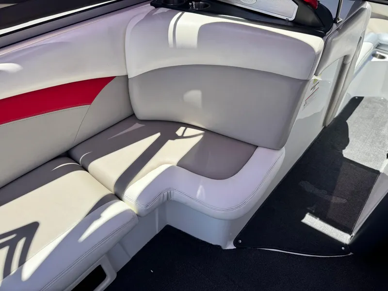 Slide: The Image of 2008 Tigé RZ2 boat interior with gray and red seating, showcasing modern design. - 27