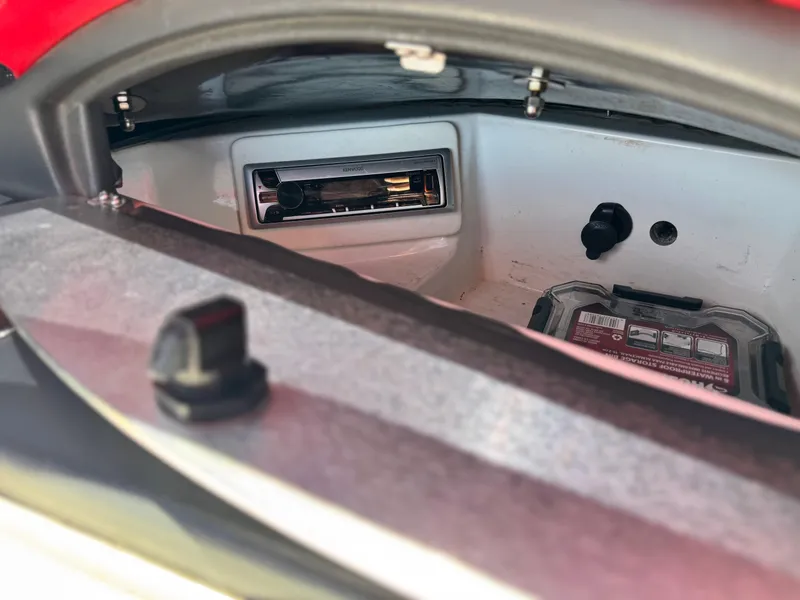Slide: The Image of Interior view of a 2008 Tigé RZ2 boat compartment with audio system. - 30