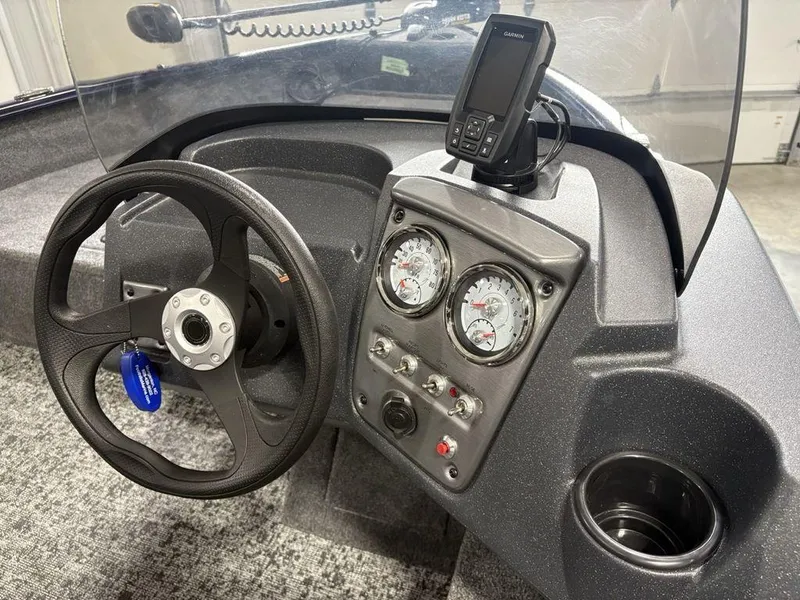 Slide: The Image of 2026 Tracker Pro Guide™ V-16 SC dashboard with steering wheel and gauges. - 10