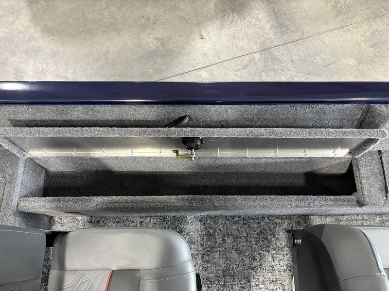Slide: The Image of 2026 Tracker Pro Guide™ V-16 SC boat interior storage compartment with gray upholstery. - 11