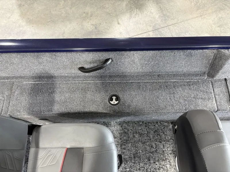 Slide: The Image of 2026 Tracker Pro Guide™ V-16 SC boat interior with gray seating and carpeted flooring. - 15