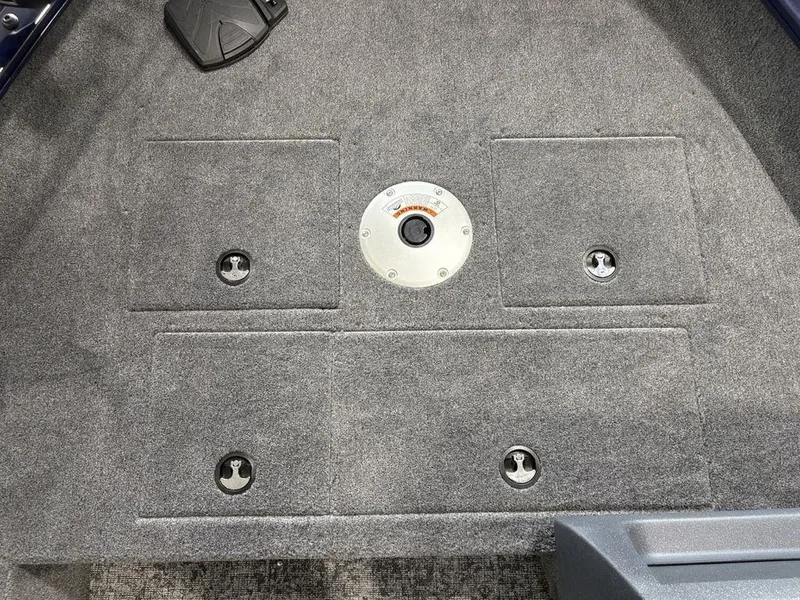 Slide: The Image of 2026 Tracker Pro Guide™ V-16 SC boat deck with storage compartments and pedal. - 4