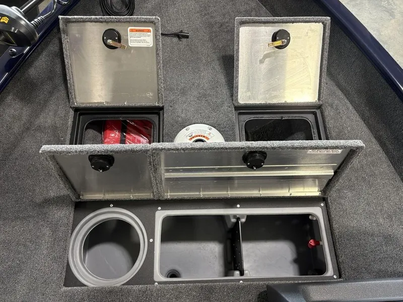 Slide: The Image of 2026 Tracker Pro Guide™ V-16 SC boat storage compartments with open lids, showcasing interior features. - 6