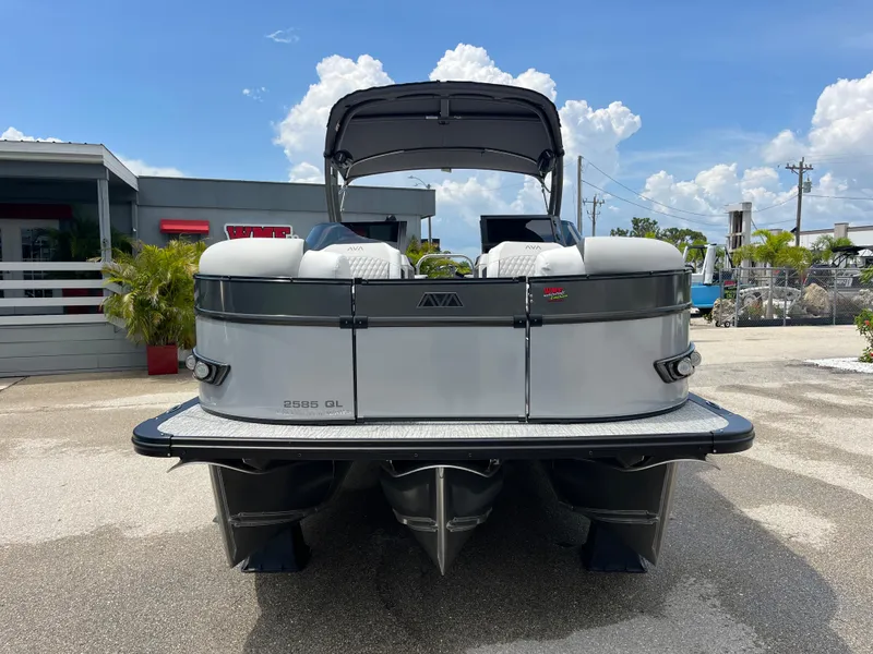 Slide: The Image of 2026 Avalon 2585 Catalina Windshield Quad Lounger boat with Mercury 400hp V-10 motor, rear view. - 2