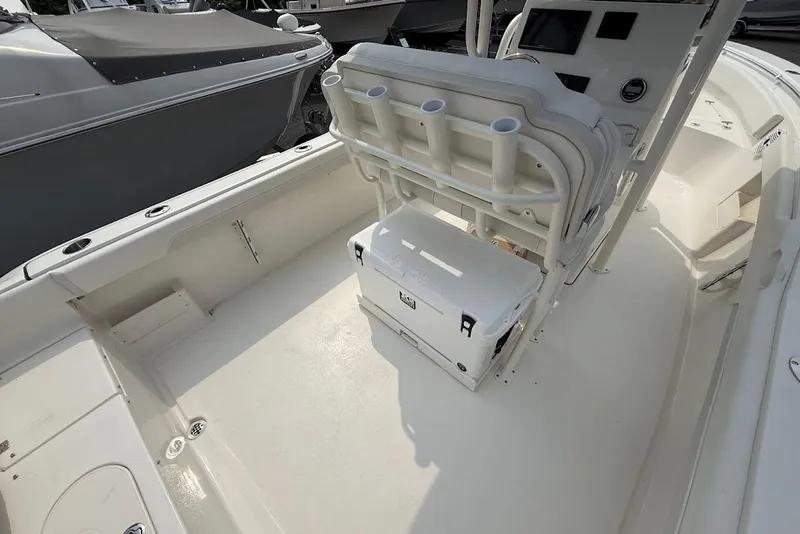 Slide: The Image of 2026 Key West 239 FS boat interior with seating and storage area. - 12