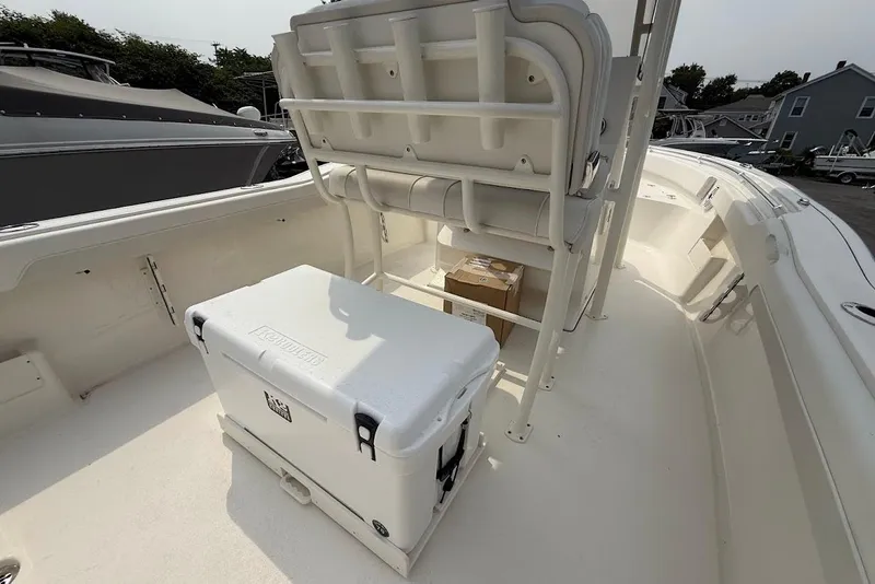 Slide: The Image of 2026 Key West 239 FS boat interior with cooler and seating. - 13