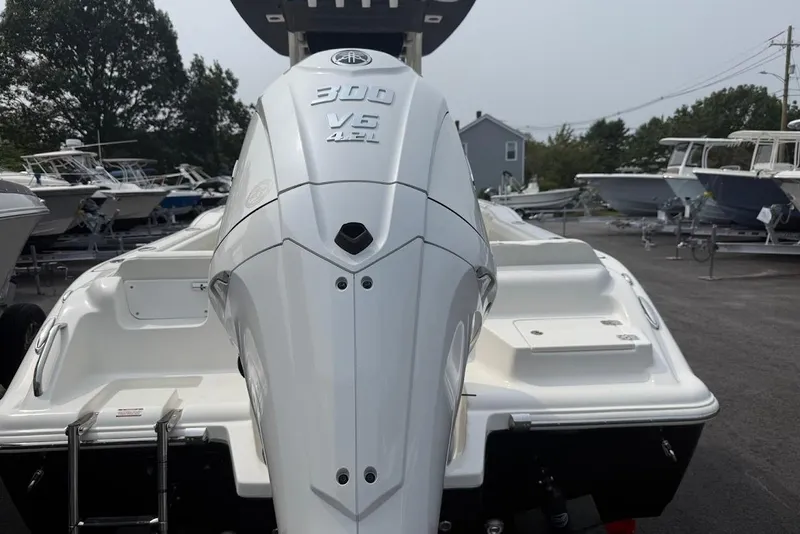Slide: The Image of 2026 Key West 239 FS boat with powerful 300 V6 engine, parked outdoors. - 17