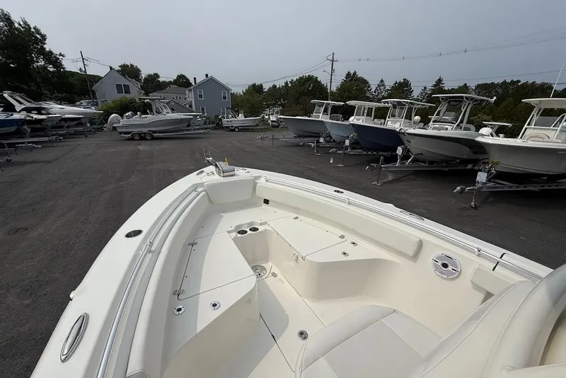 Slide: The Image of 2026 Key West 239 FS boat in a marina, surrounded by other boats on trailers. - 7