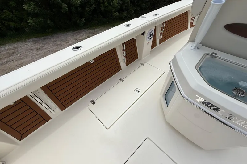 Slide: The Image of 2026 Pathfinder 2700 Open boat deck with storage compartments and livewell. - 27