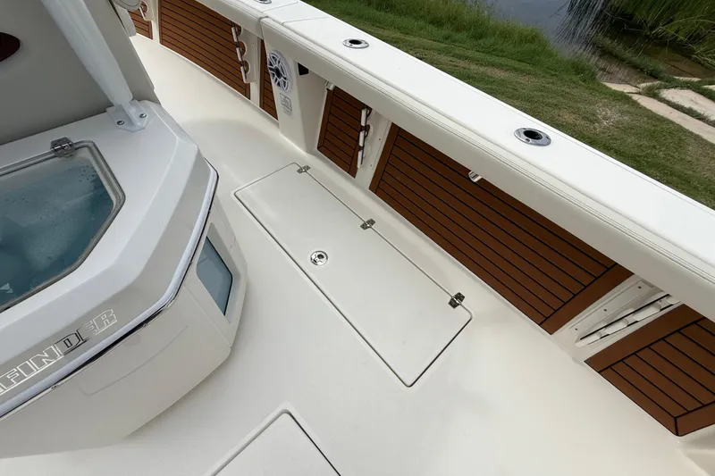 Slide: The Image of 2026 Pathfinder 2700 Open boat deck with storage compartments and sleek design. - 29