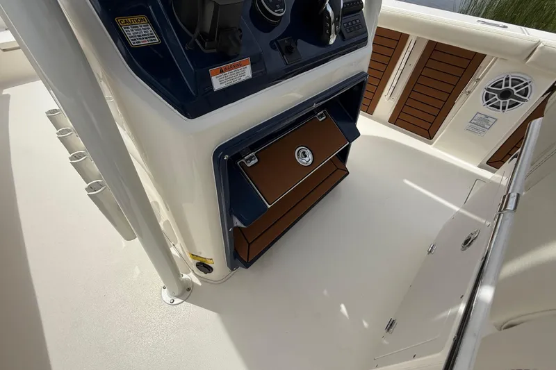 Slide: The Image of 2026 Pathfinder 2700 Open boat interior with storage compartments and control panel. - 35