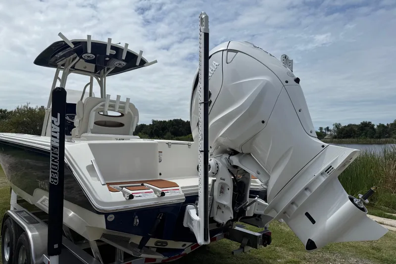Slide: The Image of 2026 Pathfinder 2700 Open boat with powerful outboard motor, parked on a trailer. - 4