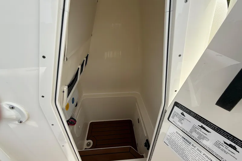Slide: The Image of Interior view of 2026 Pathfinder 2700 Open boat compartment with wood flooring. - 42