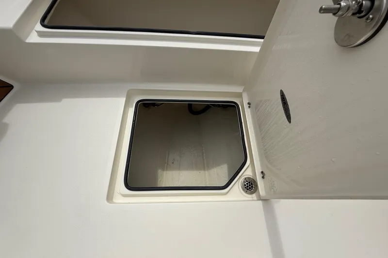 Slide: The Image of Open storage compartment on 2026 Pathfinder 2700 Open boat deck. - 44