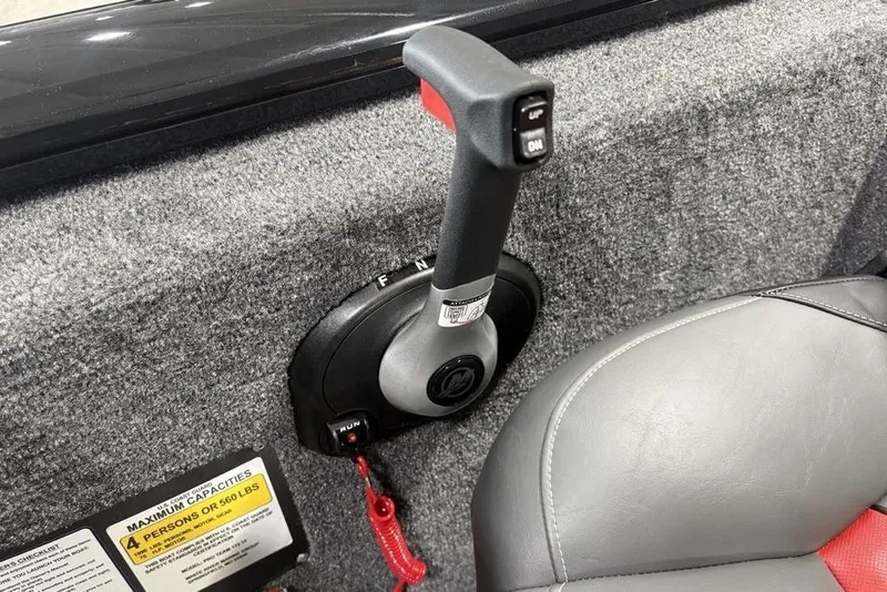 Slide: The Image of 2026 Tracker Pro Team 175 Crappie Edition boat throttle control and seating detail. - 10