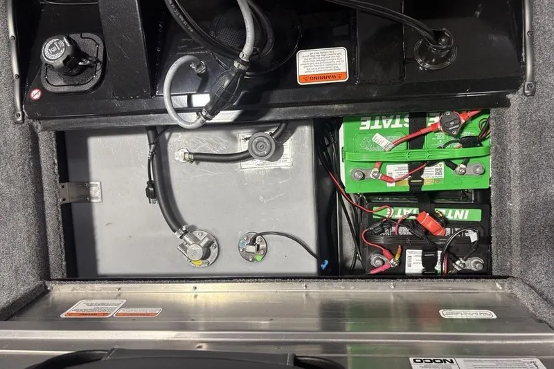 Slide: The Image of 2026 Tracker Pro Team 175 Crappie Edition boat battery compartment with wiring and components. - 17