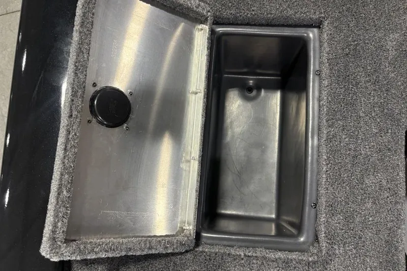 Slide: The Image of Open storage compartment in 2026 Tracker Pro Team 175 Crappie Edition boat. - 18