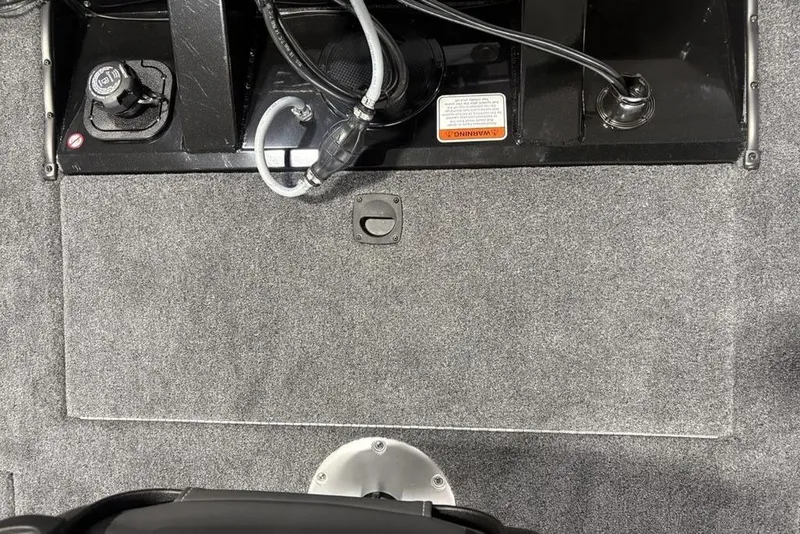 Slide: The Image of Interior view of 2026 Tracker Pro Team 175 Crappie Edition boat, featuring carpeted flooring and control panel. - 20