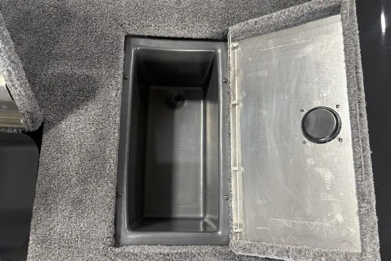 Slide: The Image of 2026 Tracker Pro Team 175 Crappie Edition boat storage compartment with open lid. - 22