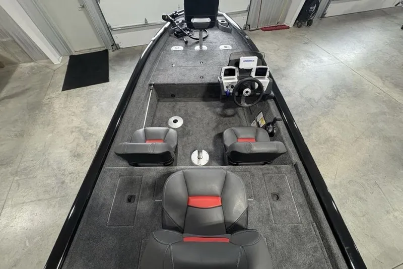 Slide: The Image of 2026 Tracker Pro Team 175 Crappie Edition boat interior with seating and steering console. - 26