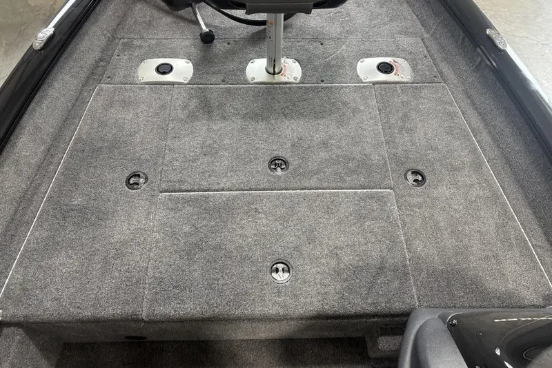Slide: The Image of 2026 Tracker Pro Team 175 Crappie Edition boat interior with gray carpeted deck. - 6