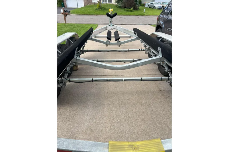 Slide: The Image of Boat trailer for 2003 Bayliner 285 on a driveway, ready for transport. - 24