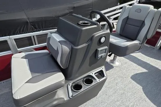 Slide: The Image of 2026 Sun Tracker BB 18 DLX boat interior with dual gray seats and steering console. - 12
