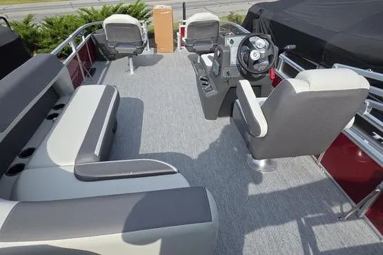Slide: The Image of 2026 Sun Tracker BB 18 DLX pontoon boat interior with seating and steering console. - 13